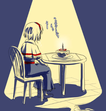 Cô gái ngồi một mình bên chiếc bánh trong ngày sinh nhật