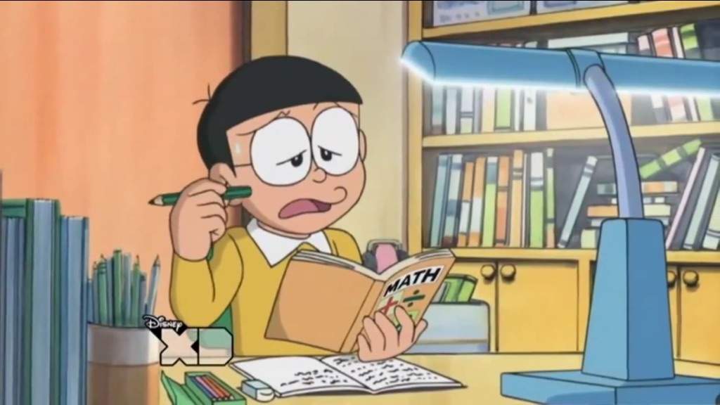 Nobita buồn chán khi học bài