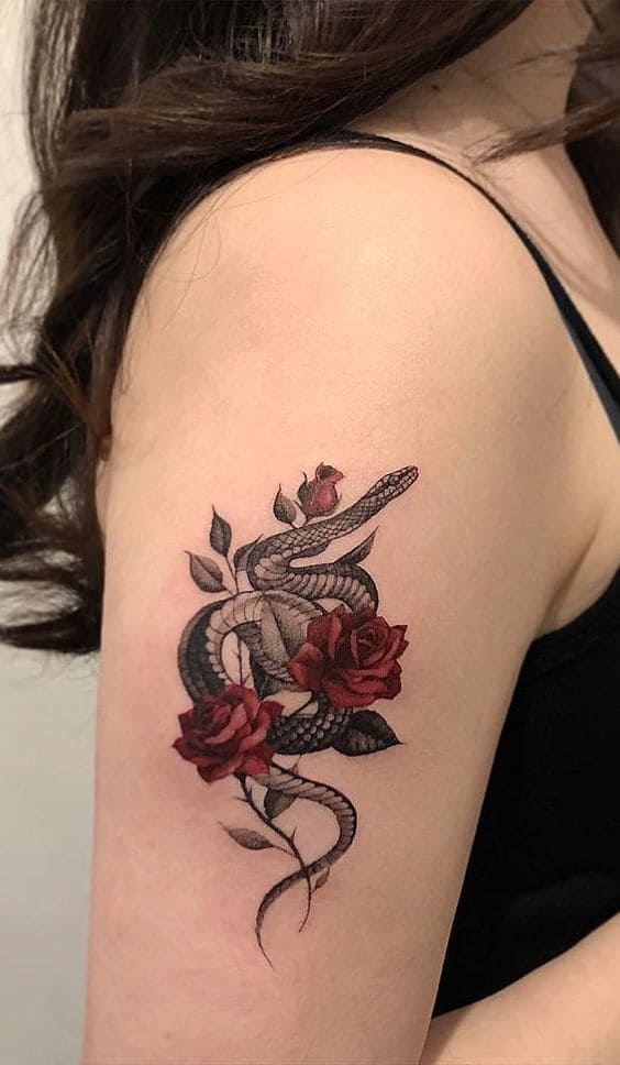 mẫu tattoo hình con cái rắn quấn hoả hồng ở cánh tay mang lại con cái gái
