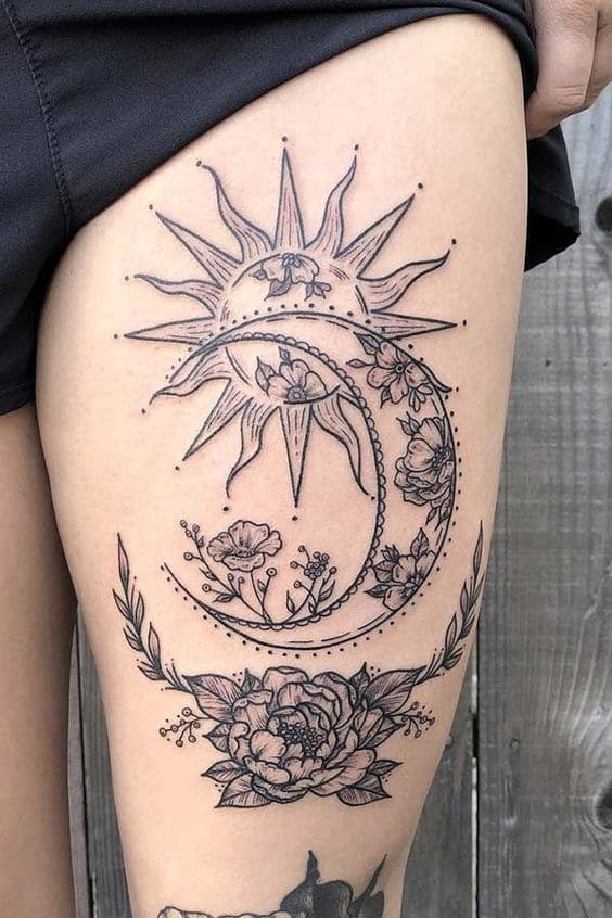 mẫu tattoo mặt trăng ôm mặt trời ở đùi nữ chất