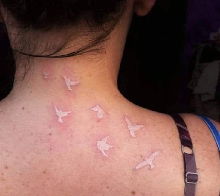 Tattoo đàn chim white độc và kỳ lạ nhất sau gáy nữ
